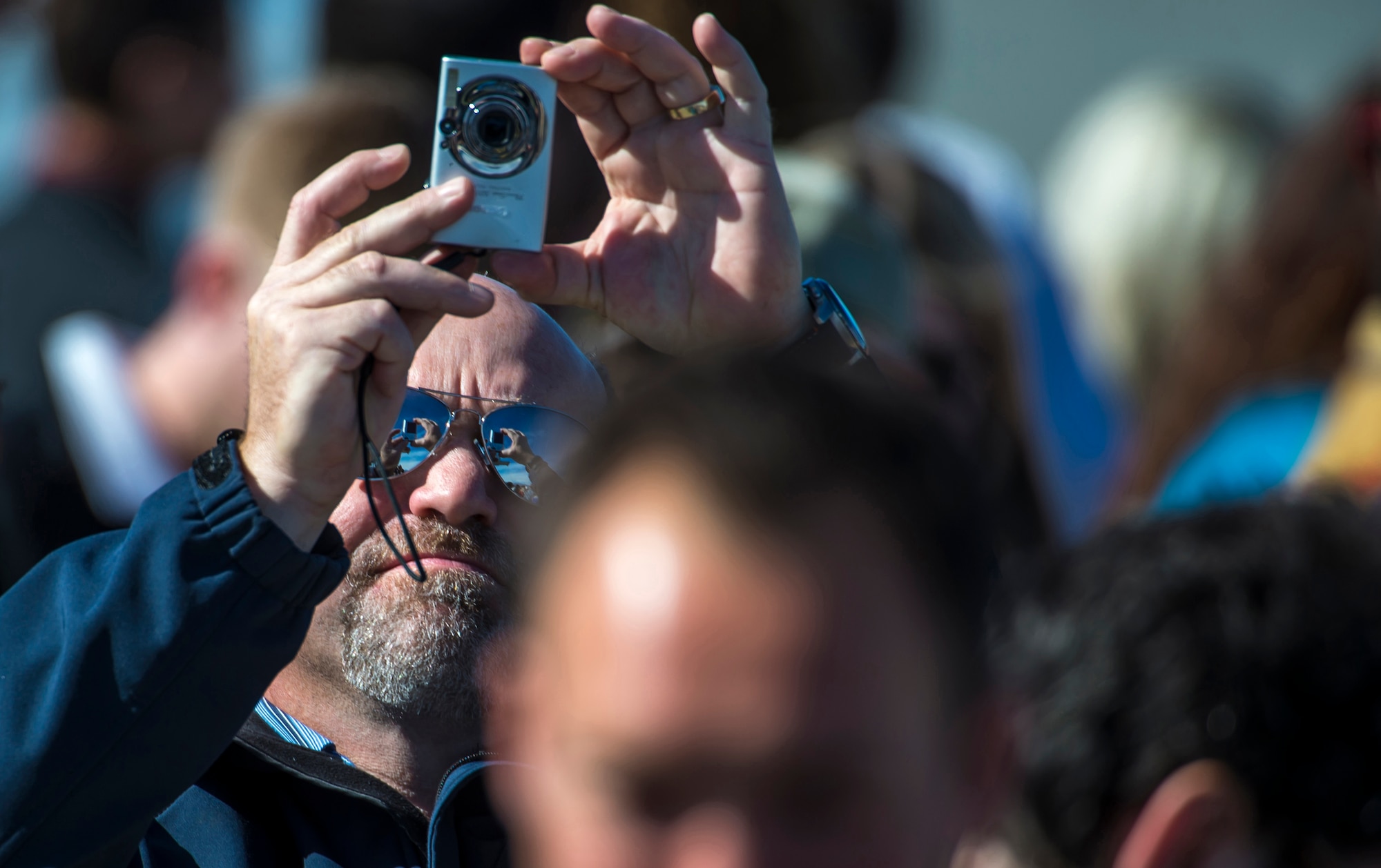 A man takes a photograph of Air Force One, with President Barack Obama on board, as it lands at Joint Base Elmendorf-Richardson, Alaska, Monday, Aug. 31, 2015. President Obama was the main speaker at a major event yesterday in Anchorage, Alaska, hosted by the U.S. Department of State entitled the Conference on Global Leadership in the Arctic: Cooperation, Innovation, Engagement and Resilience (GLACIER). GLACIER will focus the world’s attention on the most urgent issues facing the Arctic today and provide an unprecedented opportunity for foreign ministers and key stakeholders to define the region’s most crucial challenges; highlight innovative ways in which these challenges can be addressed at the local, national and international levels; and broaden global awareness of the impacts of Arctic climate change.  (U.S. Air Force photo/Justin Connaher)