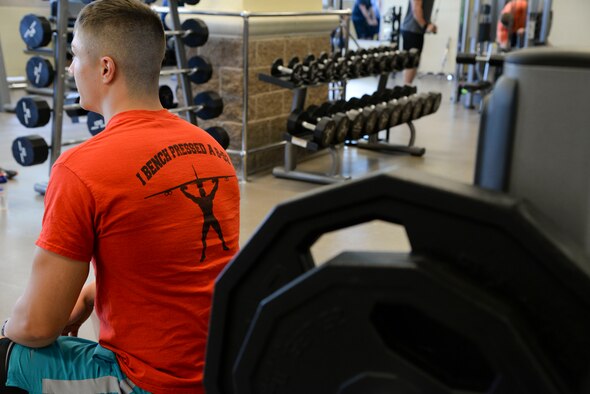 Airman 1st Class Dillon Vakoff, 96th Bomb Squadron aviation resource manager, rests between sets at the Senior Airman Bryan Bell Fitness Center at Barksdale Air Force Base, La., Aug. 31, 2015. Vakoff received a B-52 shirt upon completing the Bench a B-52 incentive program. The program was implemented to encourage and motivate Team Barksdale to reach new fitness goals. (U.S. Air Force photo/Senior Airman Jannelle Dickey)