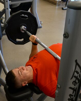 Airman 1st Class Dillon Vakoff, 96th Bomb Squadron aviation resource manager, bench presses 185 pounds at the Senior Airman Bryan Bell Fitness Center at Barksdale Air Force Base, La., Aug. 31, 2015. Vakoff completed the Bench a B-52 incentive program within three workouts by performing 1,000 reps of 185 pounds. (U.S. Air Force photo/Senior Airman Jannelle Dickey)