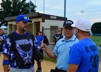 Dave Patch, Amateur Softball Association umpire, explains the rules to Rick Barker, 436th Security Force Squadron assistant coach, left, and Chad Huggins, 436th Aerial Port Squadron player-coach, right, prior to the start of an intramural softball playoff game Aug. 18, 2015, at the softball field on Dover Air Force Base, Del. The 436th SFS defeated the 436th APS 11-1 and advanced to the next round in the playoffs. (U.S. Air Force photo/Airman 1st Class William Johnson)
