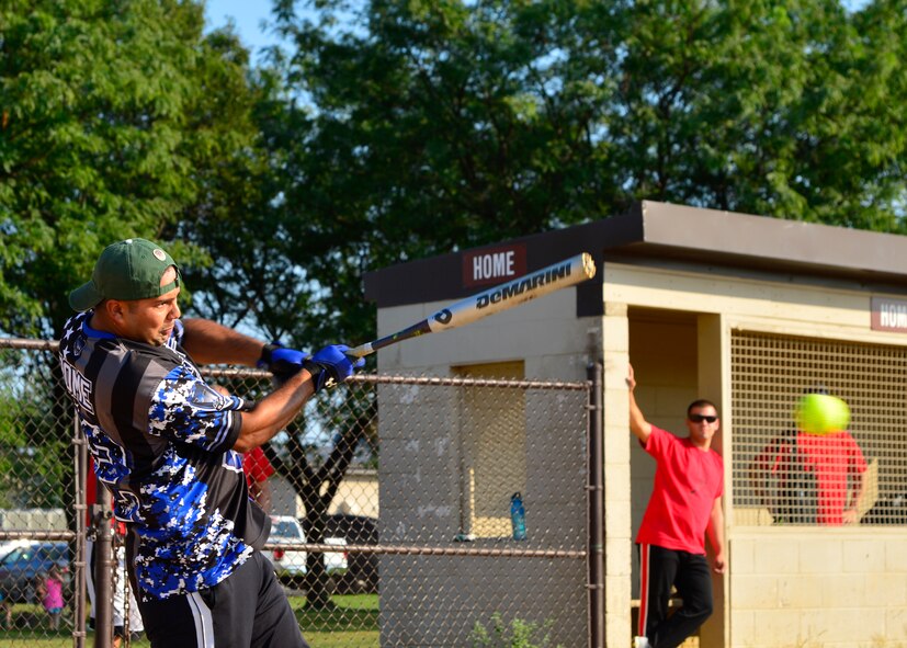 Christopher Ramos, 436th Security Forces Squadron center fielder, hits a softball during an intramural softball playoff game against the 436th Civil Engineer Squadron Aug. 17, 2015, at the softball field on Dover Air Force Base, Del. The 436th SFS lost the game 11-1, and fell into the losers’ bracket in the playoffs. (U.S. Air Force photo/Airman 1st Class William Johnson)