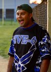 Christopher Ramos, 436th Security Forces Squadron center fielder, cheers on his team during an intramural softball game against the 373d Training Squadron Aug. 14, 2015, at the softball field on Dover Air Force Base, Del. The 436th SFS defeated the 373d TRS 20-7 and advanced into the 2015 intramural softball playoffs. (U.S. Air Force photo/Airman 1st Class William Johnson)