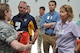 Tech. Sgt. Erin Smith, medical technician, explains to employer what kinds of supplies are available during aeromedical evacuation. Employers were invited to Peterson Air Force Base, Colo. as part of Employer Appreciation day. (U.S. Air Force photo/Capt. Cait Suttie)