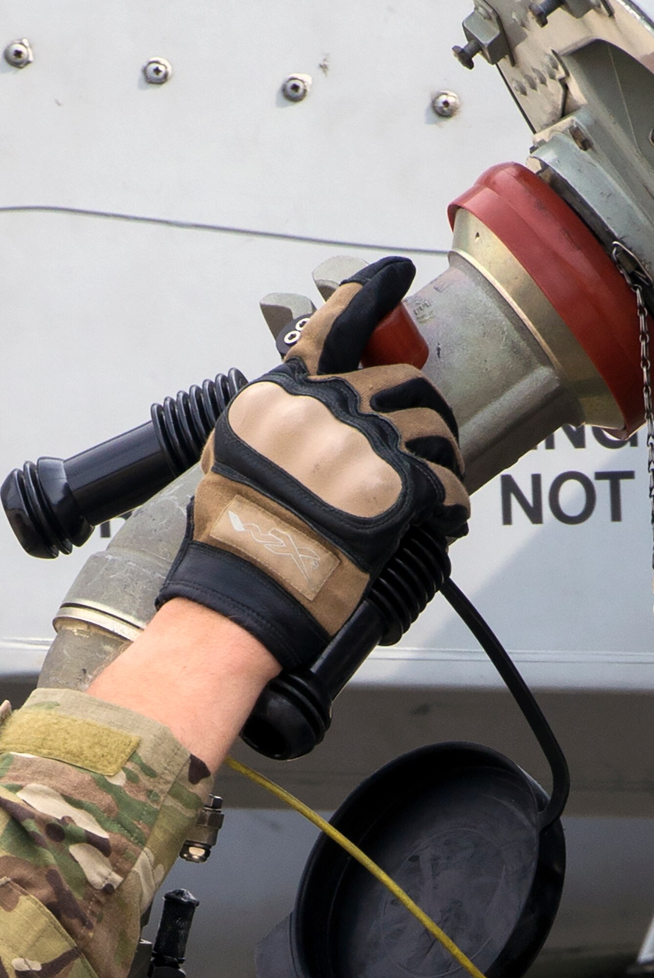 An Airman from the  23d Logistics Readiness Squadron‘s Fuel Management Flight fuels an A-10C Thunderbolt II during Forward Aerial Refueling Point training Aug. 28, 2015, at Moody Air Force Base, Ga.  The training enhances the ability of refueling sites to extend aircraft ranges by allowing aircraft to land in the FARP site’s vicinity to refuel and reengage to where they support to stay in the fight. (U.S. Air Force photo by Airman 1st Class Greg Nash/Released)  