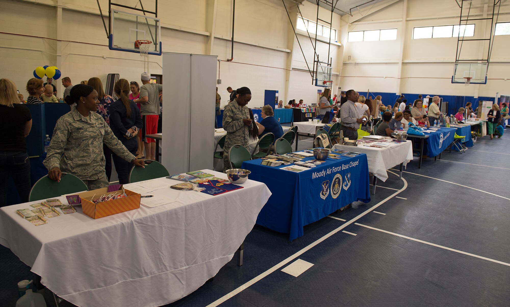 Base and community agencies fill the youth center gymnasium during the deployment expo Aug. 29, 2015 at Moody Air Force Base, Ga. The expo offered information to Airmen and families on the services that they can take advantage of before, during or after a deployment. (U.S. Air Force photo/Tech. Sgt. Zachary Wolf)