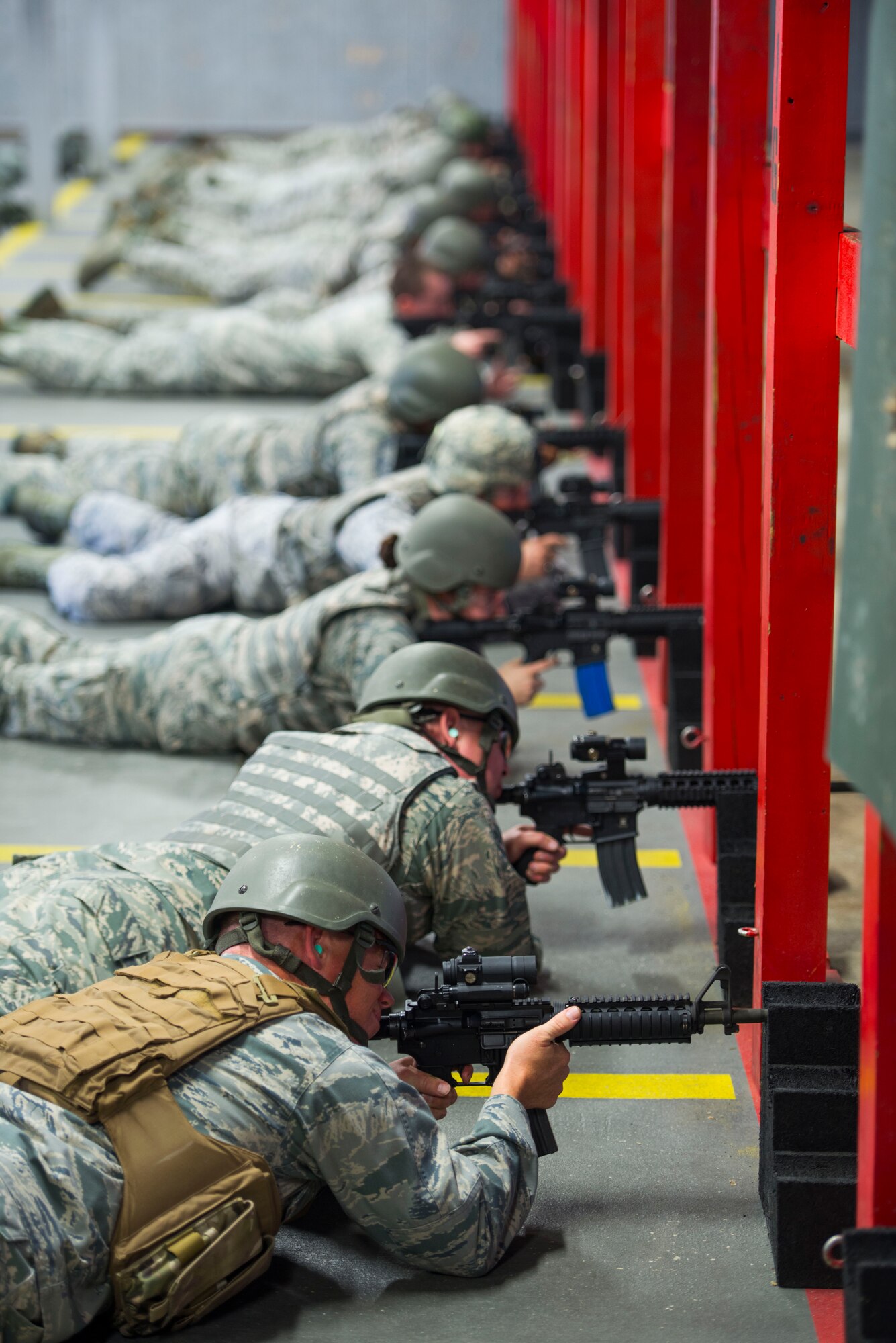Airmen fire at their targets during weapons training on Joint Base Andrews, Md., Sept. 1, 2015. The class was made up of 12 Airmen, each there to maintain readiness standards for an upcoming deployment or permanent change of station. (U.S. Air Force photo by Staff Sgt. Chad C. Strohmeyer/Released)
