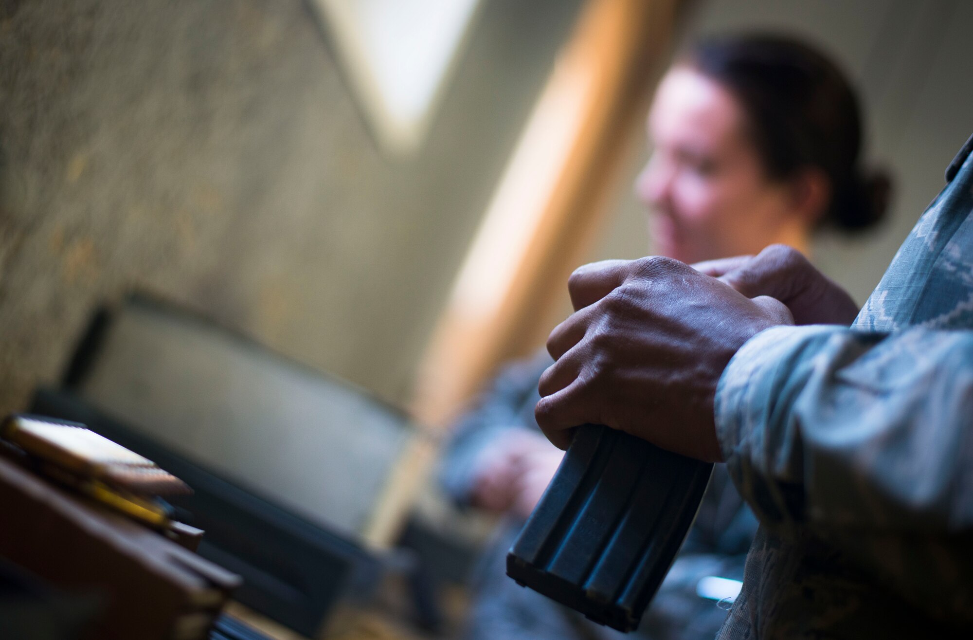 An Airman loads 5.56 mm rounds in to an M4 Carbine magazine prior to weapons training on Joint Base Andrews, Md., Sept. 1, 2015. Airmen attend weapons training on a routine basis to maintain readiness standards. (U.S. Air Force photo by Staff Sgt. Chad C. Strohmeyer/Released)