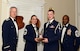 U.S. Air Force Senior Airman Joseph Sanderson, 18th Weather Squadron (right), receives the John L. Levitow Award for the Senior Master Sgt. David B. Reid Airman Leadership School Class 15-6, from Chief Master Sgt. Summer Leifer,  U.S. Air Forces Central intelligence directorate  chief enlisted manager, and 20th Fighter Wing leadership, at Shaw Air Force Base, S.C., May 15, 2014. The Levitow Award is given to the graduate with the highest average of instructor and student points, and is the highest award in enlisted professional military education. (U.S. Air Force photo by Airman 1st Class Christopher Maldonado/Released)