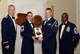 U.S. Air Force Senior Airman Joseph Sanderson, 18th Weather Squadron (right), receives the John L. Levitow Award for the Senior Master Sgt. David B. Reid Airman Leadership School Class 15-6, from Chief Master Sgt. Summer Leifer,  U.S. Air Forces Central  intelligence directorate  chief enlisted manager, , and 20th Fighter Wing leadership, at Shaw Air Force Base, S.C., Aug. 27, 2015. The Levitow Award is given to the graduate with the highest average of instructor and student points, and is the highest award in enlisted professional military education. (U.S. Air Force photo by Airman 1st Class Christopher Maldonado/Released)