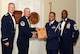 U.S. Air Force Senior Airman Christian Zamora, 51st Intelligence Squadron (right), receives a distinguished graduate award for Class 15-6 of the Senior Master Sgt. David B. Reid Airman Leadership School from Master Sgt. Gregory Spiczka, 20th Security Forces Squadron first sergeant, and 20th Fighter Wing leadership , at Shaw Air Force Base, S.C., Aug. 27, 2015. The distinguished graduate awards are given to the top 10 percent of the class for total point accumulation. (U.S. Air Force photo by Airman 1st Class Christopher Maldonado/Released)