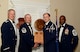 U.S. Air Force Senior Airman Cody Moehler, 20th Civil Engineer Squadron (right), receives a distinguished graduate award for Class 15-6 of the Senior Master Sgt. David B. Reid Airman Leadership School from Master Sgt. Gregory Spiczka, 20th Security Forces Squadron first sergeant, and 20th Fighter Wing leadership, at Shaw Air Force Base, S.C., Aug. 27, 2015. The distinguished graduate awards are given to the top 10 percent of the class for total point accumulation. (U.S. Air Force photo by Airman 1st Class Christopher Maldonado/Released)