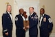U.S. Air Force Senior Airman Cody Moehler, 20th  Civil Engineer Squadron (right), receives the academic achievement award from Master Sgt. Christopher Cohen, 20th Force Support Squadron Honor Guard Superintendent, and 20th Fighter Wing leadership at the Senior Master Sgt. David B. Reid Airman Leadership School class 15-6  graduation at Shaw Air Force Base, S.C., Aug. 27, 2015. This award is given to the student with the highest point total. (U.S. Air Force photo by Airman 1st Class Christopher Maldonado/Released)