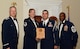 U.S. Air Force Staff Sgt. Richard Bell, 20th Air Support Operations Squadron (right), receives the Senior Master Sgt. David B. Reid Airman Leadership School Commandant’s Award for Class 15-6 from Master Sgt. Lindsey Wolf, 20th Force Support Squadron ALS commandant and 20th Fighter Wing leadership, at Shaw Air Force Base, S.C., Aug. 27, 2015. The Commandant’s Award is given to the student who most exemplifies professional military qualities as chosen by their peers, the primary instructors, and the ALS commandant. (U.S. Air Force photo by Airman 1st Class Christopher Maldonado/Released)
