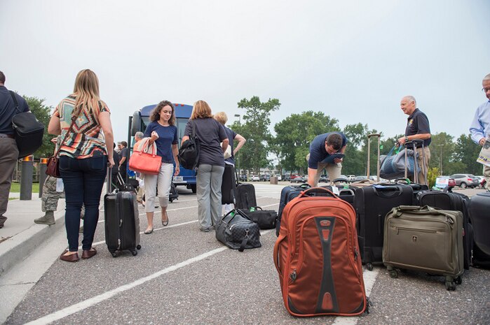 Macdill Air Force Base civic leaders grab their luggage before leaving Joint Base Charleston, S.C., Aug. 27, 2015. The civic leaders stayed for almost two days, and were presented with various opportunities to see the operational capabilities provided by JB Charleston. (U.S. Air Force photo/Senior Airman George Goslin) 