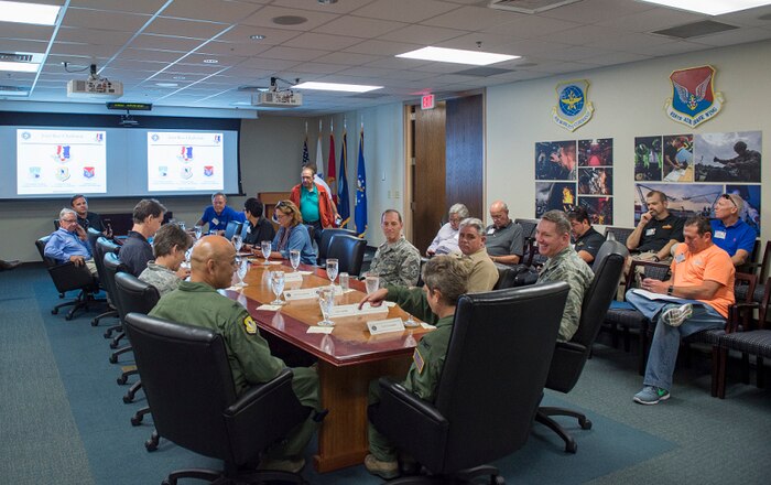 Members of Joint Base Charleston leadership give a mission brief to Macdill Air Force Base civic leaders, Aug. 27, 2015, at Joint Base Charleston, S.C. The civic leaders stayed for almost two days, and were presented with various opportunities to see the operational capabilities provided by JB Charleston. (U.S. Air Force photo/Senior Airman George Goslin) 