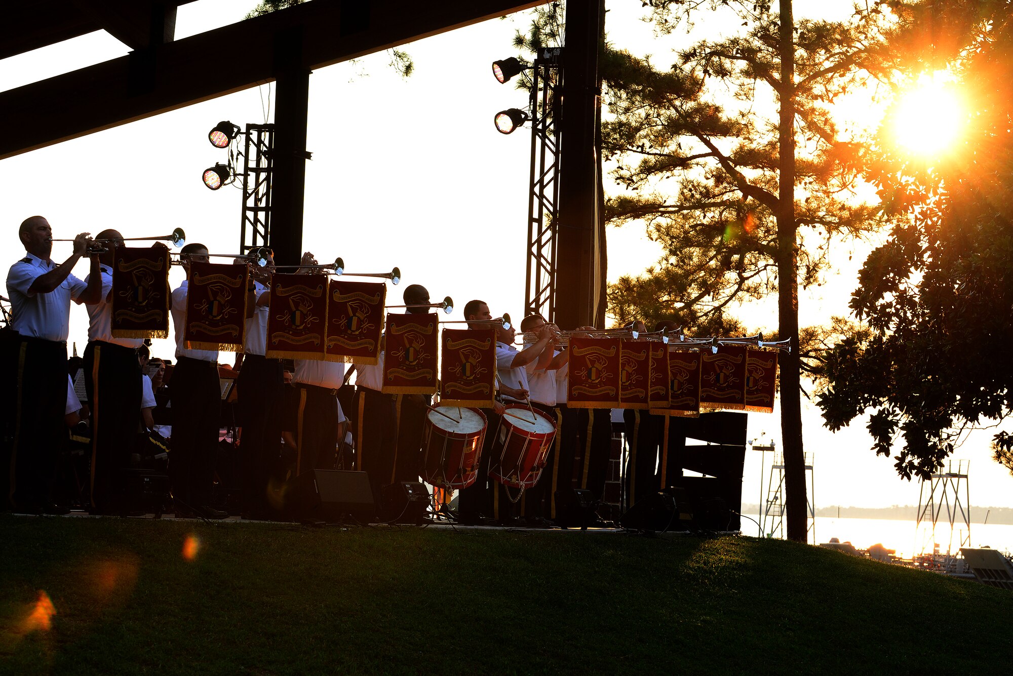 U.S. Army Training and Doctrine Command Band begin their final concert of their summer series “Music Under the Stars,” at Fort Eustis, Va., Aug. 28, 2015. The show, titled 1812 Overture, was concluded with the TRADOC Salute Battery who fired simultaneous cannon rounds during the song. (U.S. Air Force photo by Senior Airman Kimberly Nagle/Released)