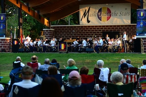 Music goers gather in Mangolia Park for the final summer concert series show “Music Under the Stars,” at Fort Eustis, Va., Aug. 28, 2015. The U.S. Army Training and Doctrine Command Band played songs such as “Liberty Bell” and “Stars and Stripes Forever,” by John Philip Susoa during the hour long performance. (U.S. Air Force photo by Senior Airman Kimberly Nagle/Released) 
