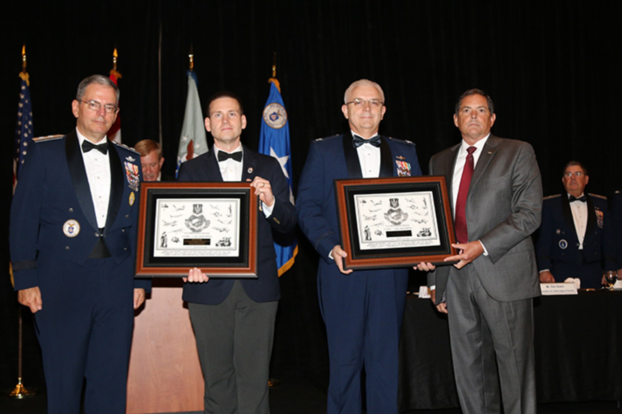 Maj. Gen. Joe Vazquez, Civil Air Patrol National Commander,  flanks CAP members Maj. Justin Ogden and Col. Brian Ready, along with John Griffin, 1st Air Force (Air Forces Northern) Chief of Staff, during the Civil Air Patrol annual awards ceremony Aug. 29.  Ogden and Ready received the 2014 AFNORTH Commander's Award for their work on CAP's Cell Phone Forensics Team. (Photo Released by Susan Schneider/CAP National Headquarters)