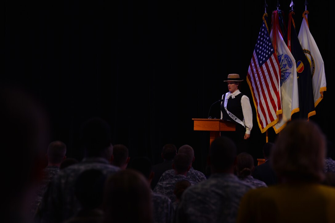 U.S Army Col. Allana Bryant, Women’s Equality Observance mistress of ceremonies, speaks during the Women’s Equality Observance event Aug. 26, 2015, at Fort Eustis, Va. During her speech, Bryant reviewed women’s movements and accomplishments dating back to the Revolutionary War. (U.S. Air Force photo by Staff Sgt. Natasha Stannard/Released) 