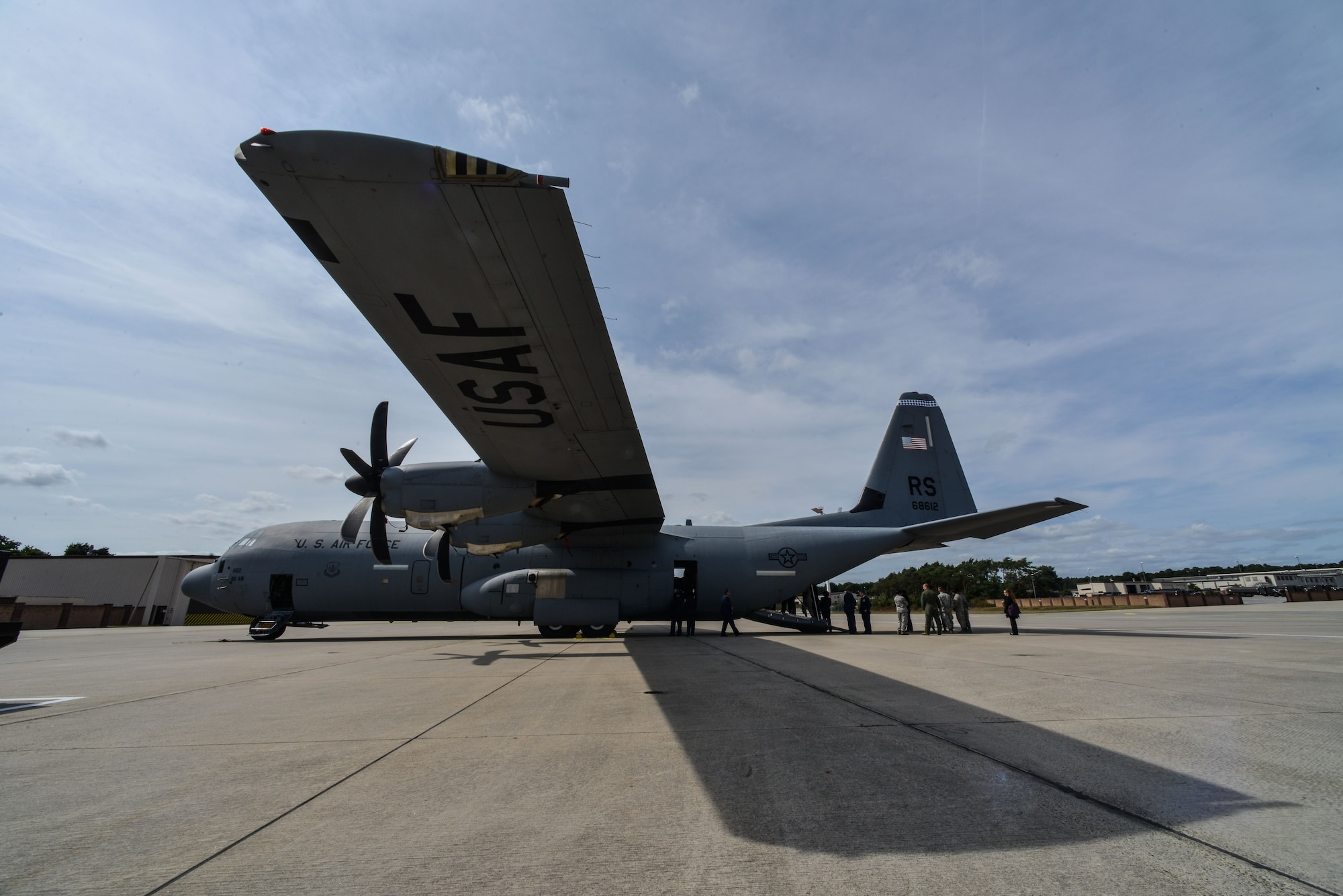 More than 60 NATO officers gather both near and inside of a C-130J Super Hercules Aug. 25, 2015, at Ramstein Air Base, Germany. Airmen from the 86th Aerospace Medicine Squadron showed them how an injured patient is moved onto the aircraft. (U.S. Air Force photo/Senior Airman Nicole Sikorski)
