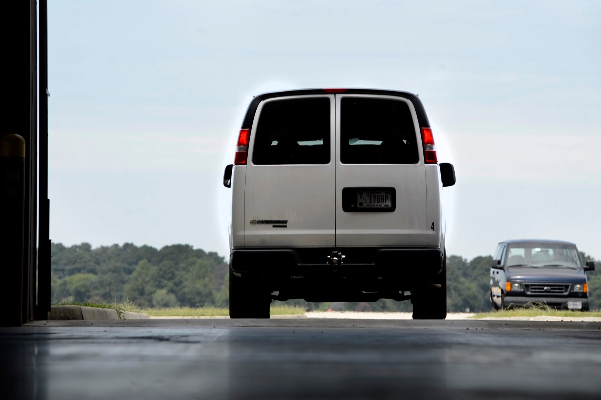 Joint Task Force-Civil Support personnel in a government-owned vehicle drive onto the flight line after being inspected during a Phase I Deployment Readiness Exercise at Langley Air Force Base, Va., Aug. 25, 2015. Partnering with the JTF-CS from Fort Eustis, Va., U.S. Air Force Airmen inspected cargo before it was uploaded onto a C-17 Globemaster III assigned to Joint Base Charleston, S.C. (U.S. Air Force photo by Senior Airman Kayla Newman/Released)