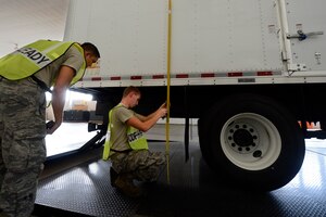 U.S. Air Force Airmen assigned to the 633rd Logistics Readiness Squadron inspect a government-owned vehicle during an exercise at Langley Air Force Base, Va., Aug. 25, 2015. The simulated mass deployment exercise tested Joint Base Langley-Eustis personnel in their ability to rapidly deploy within 72 hours.  (U.S. Air Force photo by Senior Airman Kayla Newman/Released)
