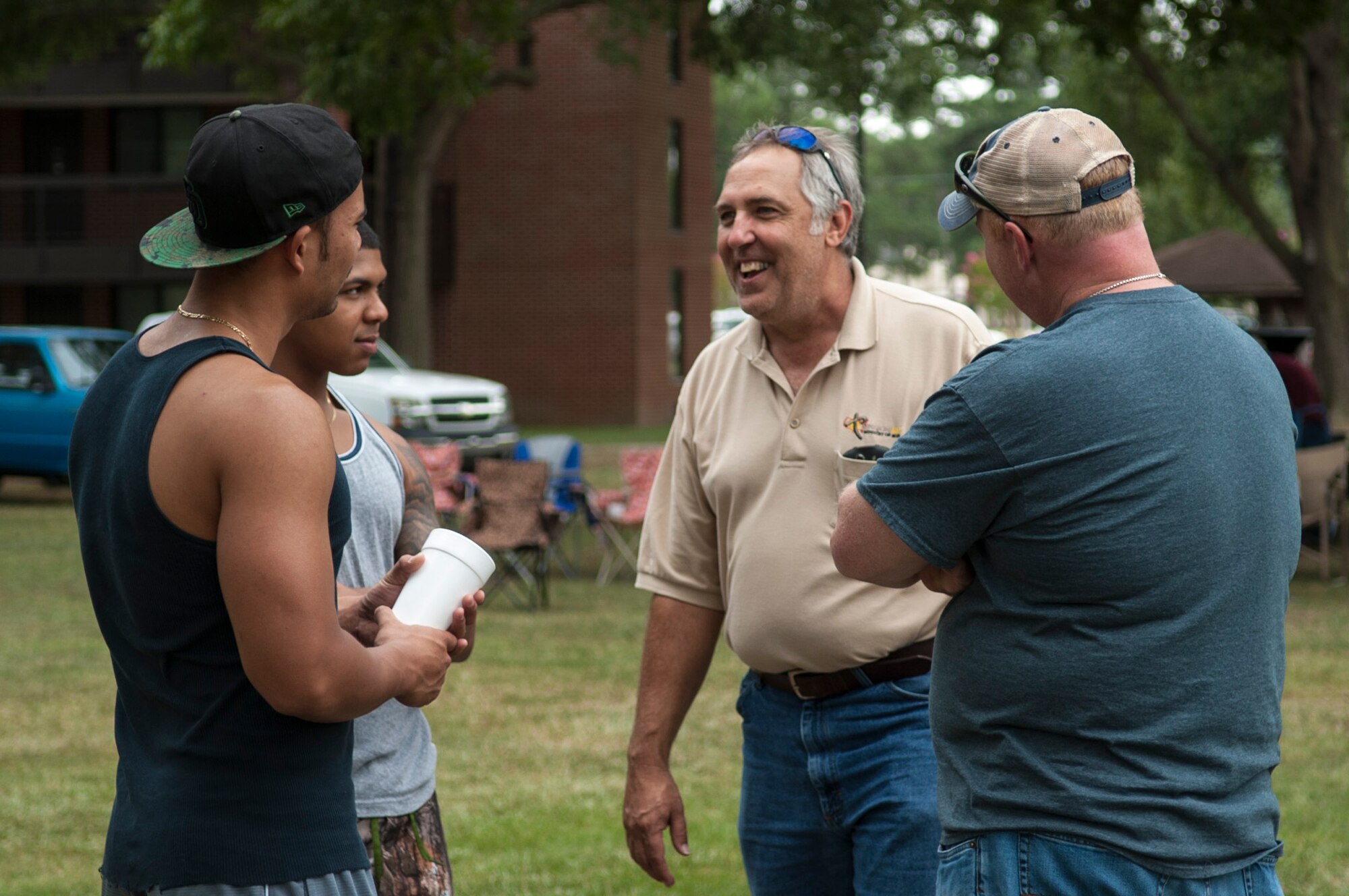 Airmen talk to volunteers from local churches during the Summer Music Fest, Aug. 29, 2015, at Seymour Johnson Air Force Base, North Carolina. Local community church members teamed up with the Airmen’s Dorm Council to host the event that brought together more than 130 dorm Airmen to enjoy food, fun and fellowship. (U.S. Air Force photo/Airman 1st Class Shawna L. Keyes)