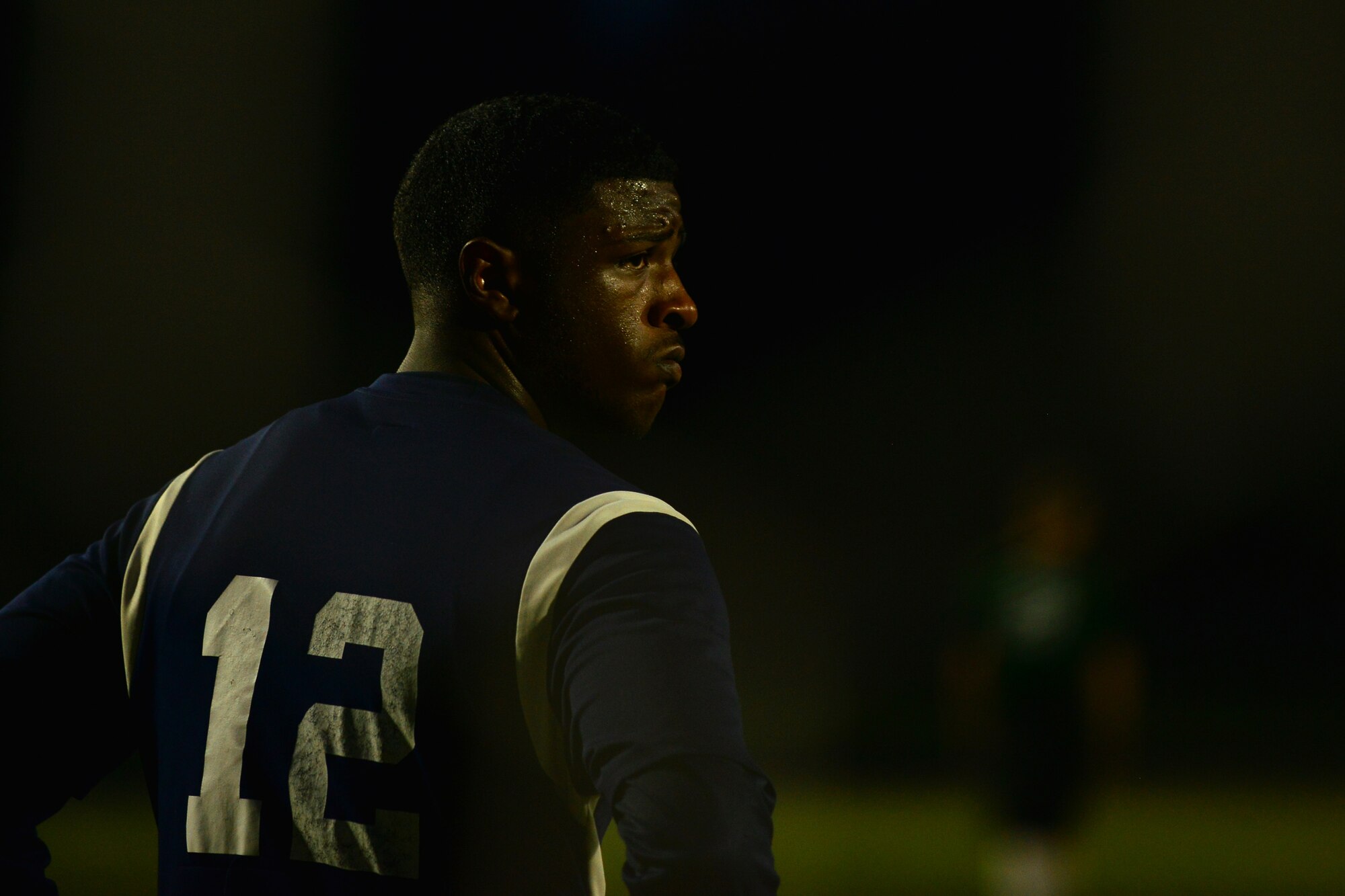 U.S. Air Force Airman 1st Class Sterling Hopkins, Langley All Star goalkeeper, rests during a time out during the Joint Base Langley-Eustis intramural soccer championship Aug. 26, 2015, at Fort Eustis, Va. Hopkins played his position for the entirety of the 120 minute long championship. (U.S. Air Force photo by Staff Sgt. Natasha Stannard/Released)