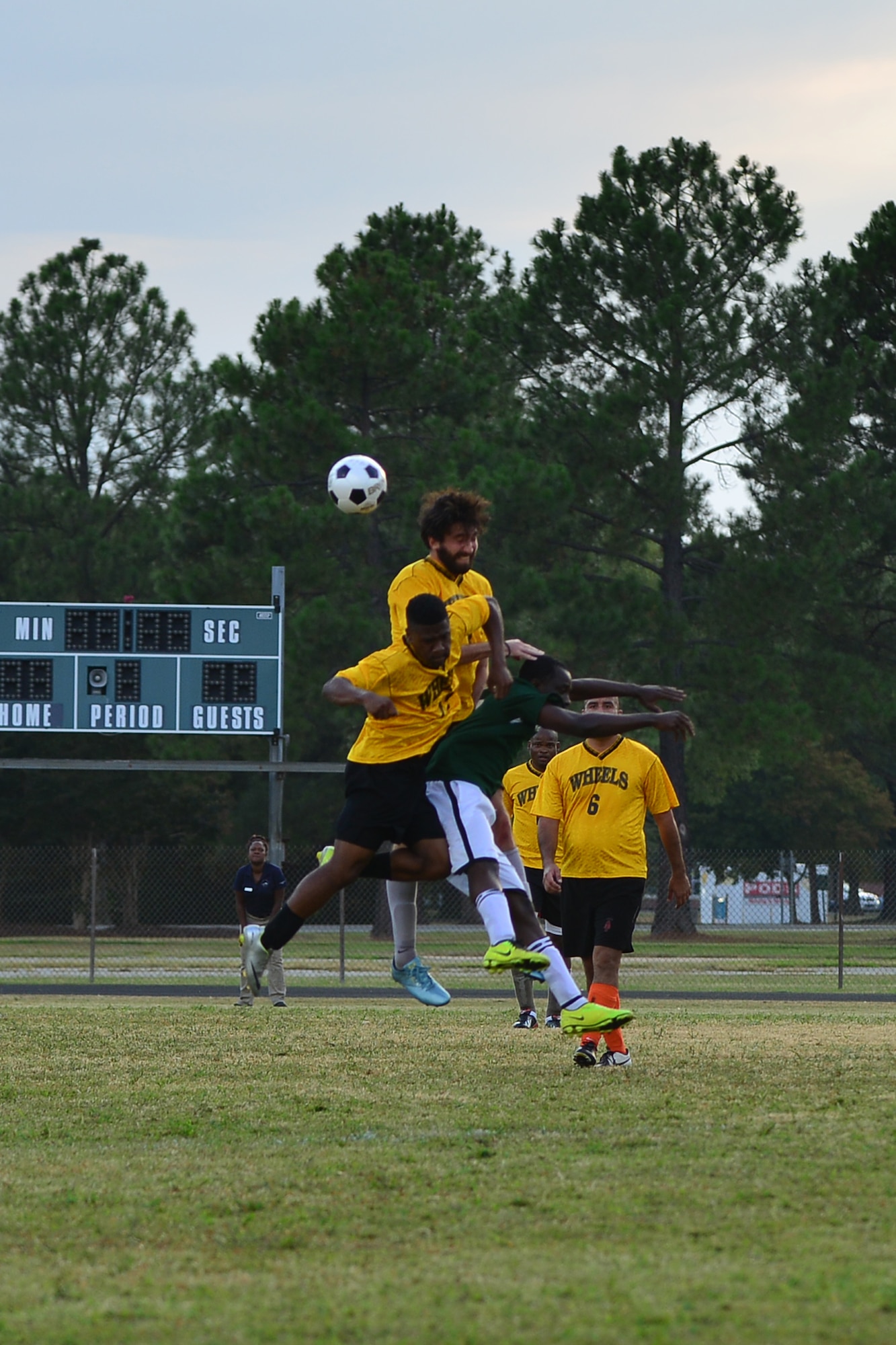 Players jump for the soccer ball during the Joint Base Langley-Eustis intramural soccer championship game Aug. 26, 2015, at Fort Eustis, Va. The teams were made up of JBLE military and civilian members, who played during their installation’s regular season. (U.S. Air Force photo by Staff Sgt. Natasha Stannard/Released)