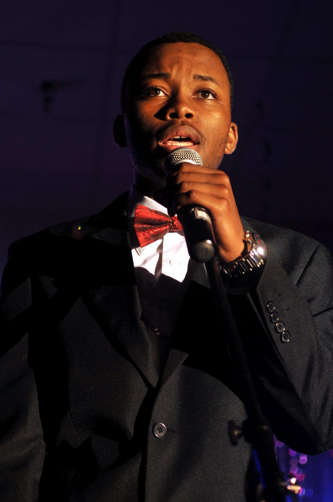 Senior Airman Larry Bowman, 319th Logistics Readiness Squadron, performs a song that he wrote and produced Aug. 28, 2015, at the AMC Icon competition on Grand Forks Air Force Base, North Dakota. Contestants were judged on technical excellence and showmanship, with the top performer being chosen to advance to Command Finals at Scott Air Force Base, Ill. (U.S. Air Force photo/Staff Sgt. Susan L. Davis)