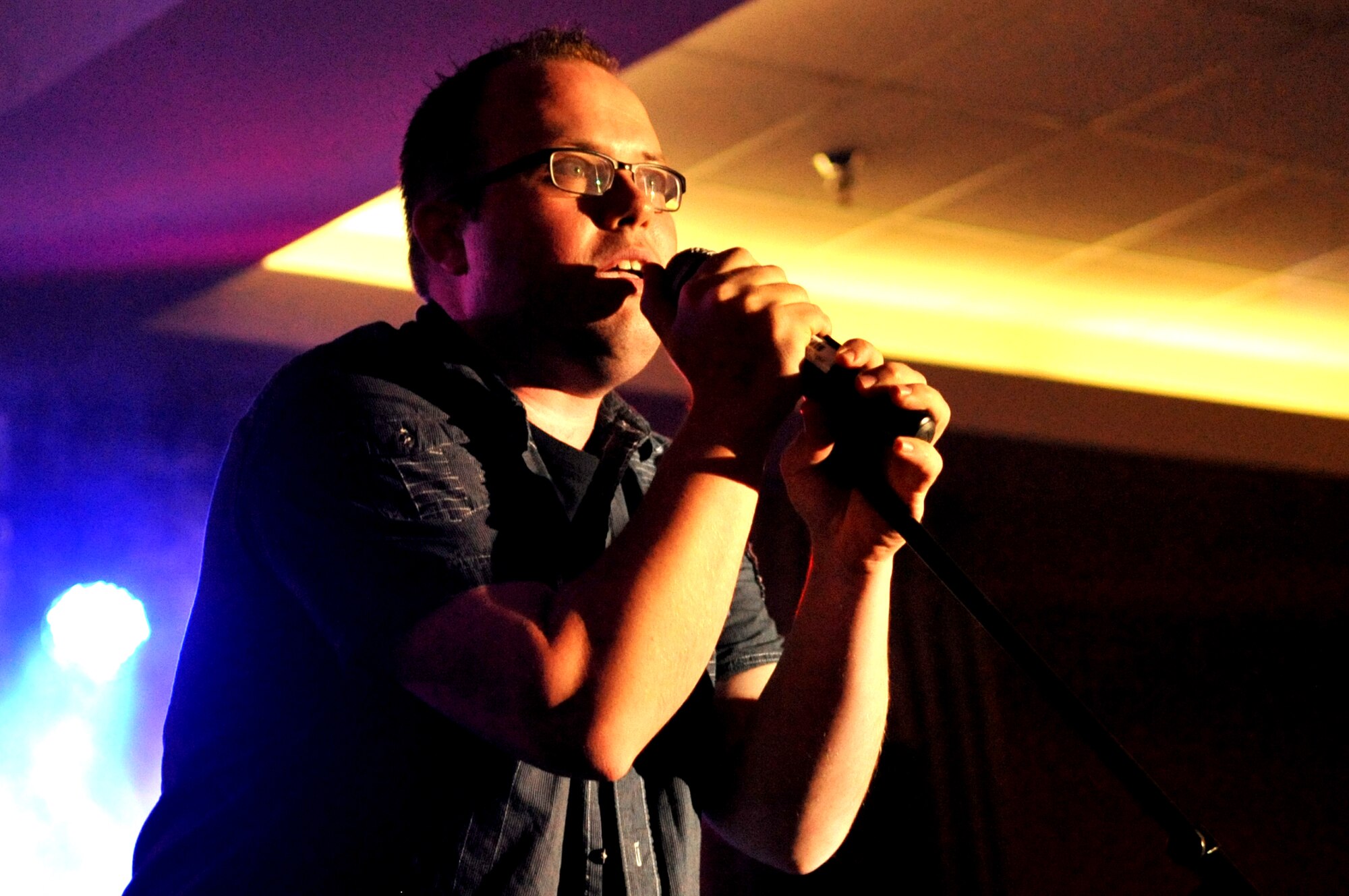 Staff Sgt. James Mokszycke, 348th Reconnaissance Squadron, performs “Smooth” by Rob Thomas and Carlos Santana Aug. 28, 2015 at the AMC Icon competition on Grand Forks Air Force Base, North Dakota. Contestants were judged on technical excellence and showmanship, with the top performer being chosen to advance to Command Finals at Scott Air Force Base, Ill. (U.S. Air Force photo/Staff Sgt. Susan L. Davis)