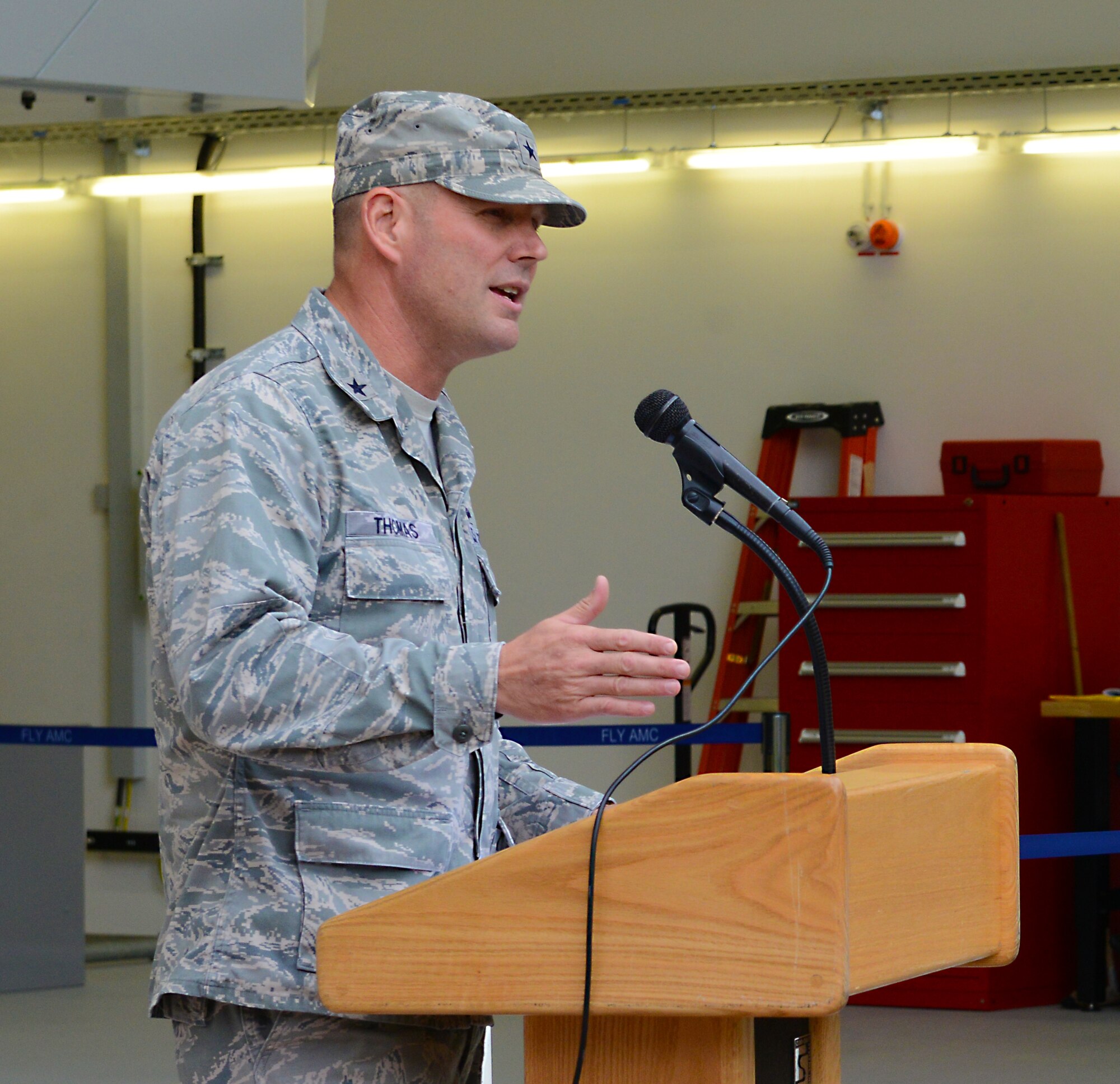Brig. Gen. Jon T. Thomas, 86th Airlift Wing commander, speaks during the ribbon cutting ceremony for the C-130J Super Hercules Flight Simulator Aug. 24, 2015, at Ramstein Air Base, Germany. The multi-million dollar simulator is expected to save U.S. Air Forces in Europe approximately $250,000 a year in travel and lodging costs by alleviating the need to send pilots to the U.S. to train on simulators. (U.S. Air Force photo/Senior Airman Timothy Moore)