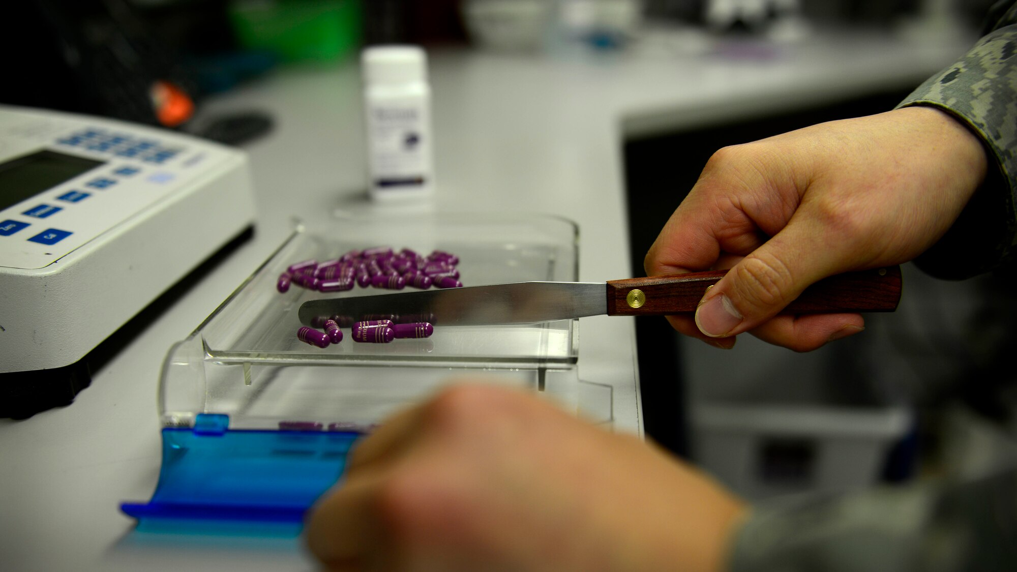 U.S. Air Force Staff Sgt. Charles Shin, 31st Medical Support Squadron Pharmacy technician, fills a prescription, Aug. 31, 2015, at Aviano Air Base, Italy. The pharmacy fills more than 200 prescriptions a day. (U.S. Air Force photo by Senior Airman Areca T. Wilson/Released)