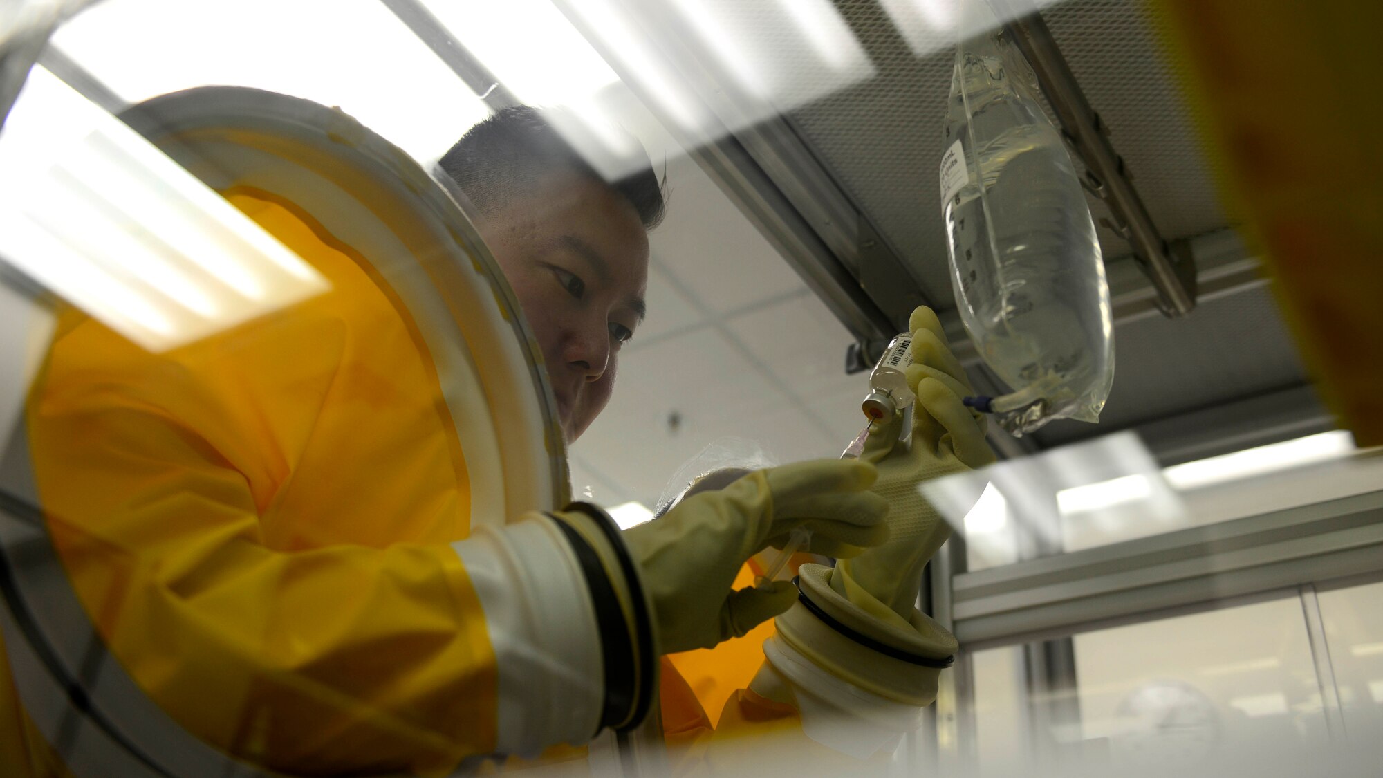 U.S. Air Force Staff Sgt. Charles Shin, 31st Medical Support Squadron Pharmacy technician, prepares I.V. medication, Aug. 31, 2015, at Aviano Air Base, Italy. The pharmacy provides I.V. to inpatient clinics. It is open from 7:30 a.m. to 5 p.m., Monday through Friday. (U.S. Air Force photo by Senior Airman Areca T. Wilson/Released)
