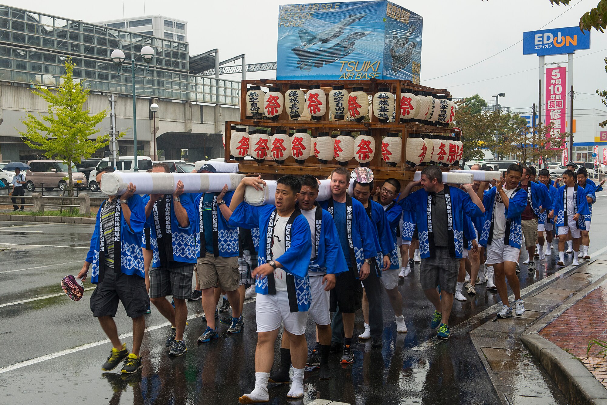U.S. Air Force members from the 44th Fighter Squadron and 44th Aircraft Maintenance Unit along with members of the Japan Air Self-Defense Force carry an Omikoshi (portable shrine) during a parade in Yukuhashi City, Japan, Aug. 29, 2015. The members deployed to Tsuiki, Japan, to participate in a two-week Aviation Training Relocation from Kadena Air Base, Japan, to help build interoperablitiy between the two forces. While deployed, the Airmen also interacted with the local community by volunteering at daycares and schools in the area and participating in numerous community outreach events. (U.S. Air Force photo by Senior Airman Stephen G. Eigel)
