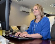 Marlene Teekell, 352nd Special Operations Wing commander’s secretary and protocol liaison officer, adds an appointment to her commander’s calendar Aug. 20, 2015, on RAF Mildenhall, England. Teekell takes care of many daily tasks including her commander’s travel plans, letters and phone calls, as well as protocol duties. (U.S. Air Force photo by Gina Randall/Released)