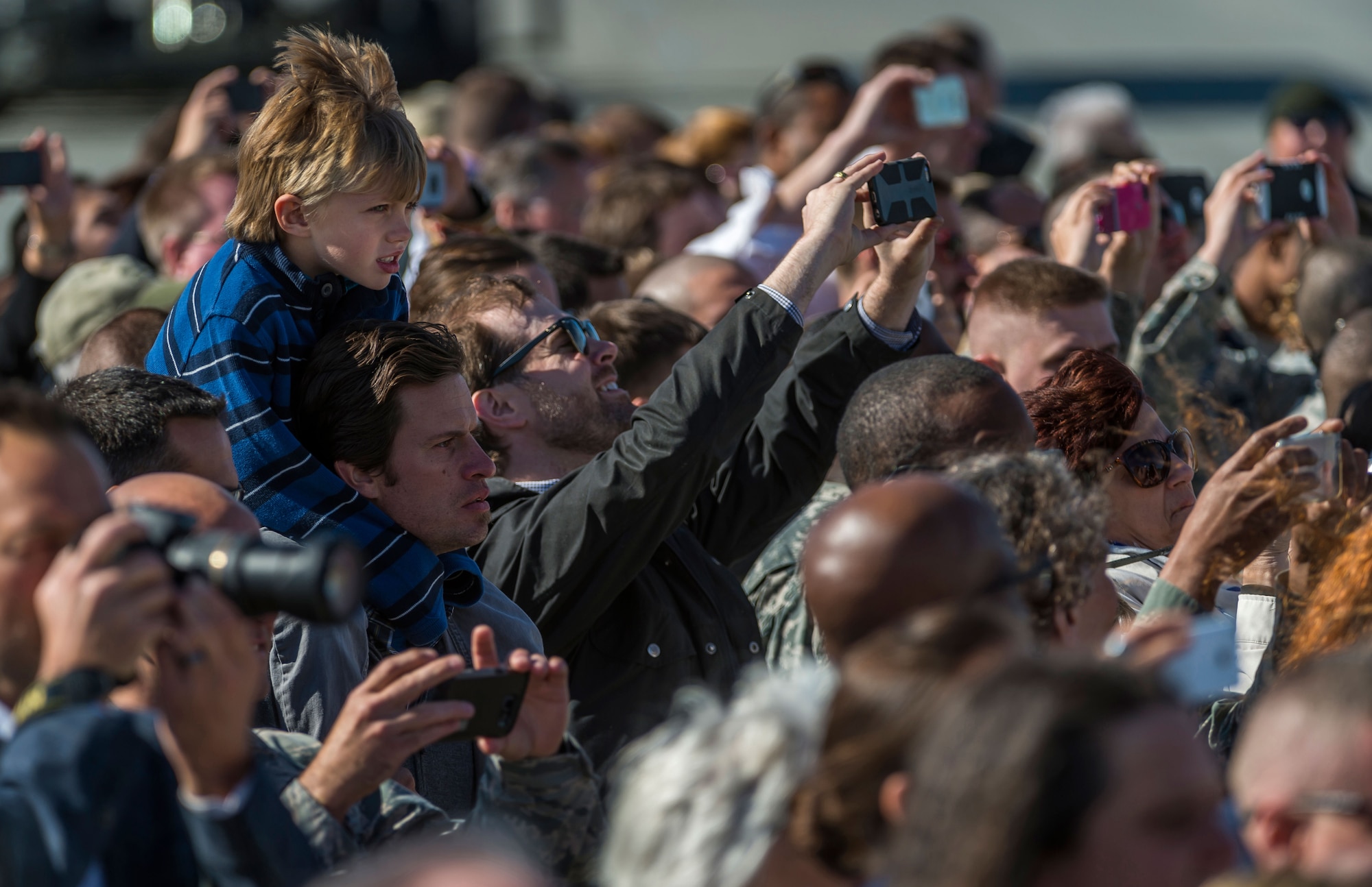 A child watches President Barack Obama disembark Air Force One at Joint Base Elmendorf-Richardson, Alaska, Monday, Aug. 31, 2015. President Obama was the main speaker at a major event yesterday in Anchorage, Alaska, hosted by the U.S. Department of State entitled the Conference on Global Leadership in the Arctic: Cooperation, Innovation, Engagement and Resilience (GLACIER). GLACIER will focus the world’s attention on the most urgent issues facing the Arctic today and provide an unprecedented opportunity for foreign ministers and key stakeholders to define the region’s most crucial challenges; highlight innovative ways in which these challenges can be addressed at the local, national and international levels; and broaden global awareness of the impacts of Arctic climate change.  (U.S. Air Force photo/Justin Connaher)
