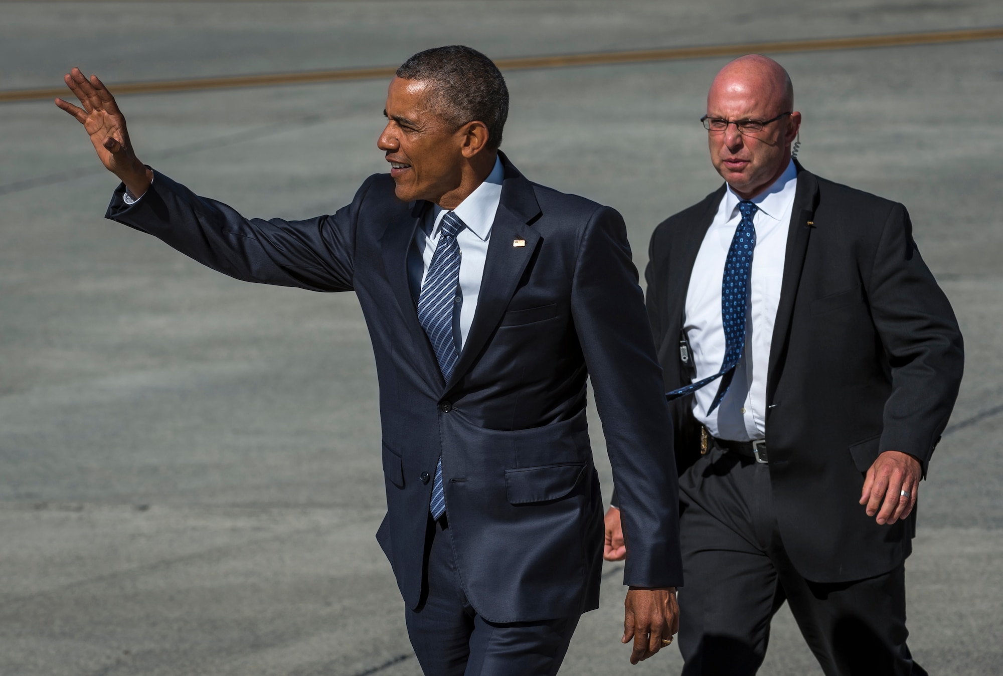 President Barack Obama waves to a crowd after disembarking Air Force One at Joint Base Elmendorf-Richardson, Alaska, Monday, Aug. 31, 2015. President Obama was the main speaker at a major event yesterday in Anchorage, Alaska, hosted by the U.S. Department of State entitled the Conference on Global Leadership in the Arctic: Cooperation, Innovation, Engagement and Resilience (GLACIER). GLACIER will focus the world’s attention on the most urgent issues facing the Arctic today and provide an unprecedented opportunity for foreign ministers and key stakeholders to define the region’s most crucial challenges; highlight innovative ways in which these challenges can be addressed at the local, national and international levels; and broaden global awareness of the impacts of Arctic climate change.  (U.S. Air Force photo/Justin Connaher)