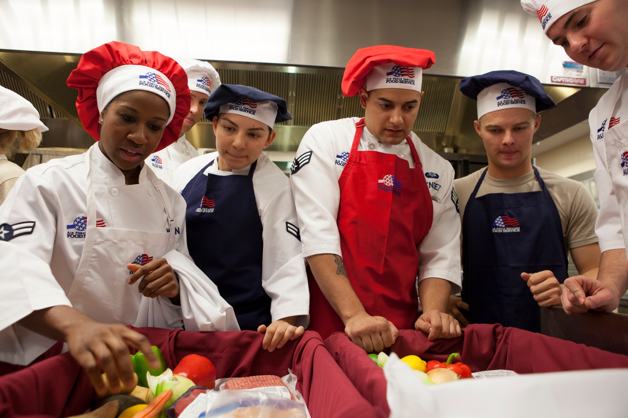 Chefs from 90th Force Support Squadron review their ingredients prior to the start of a culinary  competition held at the Chadwell Dining Facility on F.E. Warren Air Force Base, Wyo., Aug. 27, 2015. The winning team will compete in Air Force Global Strike Command's Global Strike Challenge. (U.S. Air Force photo by Lan Kim)