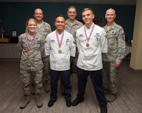 Staff Sgt. Shasta Ward, 90th Force Support Squadron missile feeding non-commissioned officer in charge; Airman 1st Class Ruel Abastas, 90th FSS missile chef; and Airman Joseph Szafranski, 90th FSS food service apprentice, pose with Col. Trevor Flint, 90th Maintenance Group commander; Col. Stephen Kravitsky, 90th Missile Wing commander; and Chief Master Sgt. John Facemire, 90th Mission Support Group command chief, after winning a culinary competition at the Chadwell Dining Facility on F.E. Warren Air Force Base, Wyo., Aug. 27, 2015. The team will compete in the Global Strike Challenge against other Air Force Global Strike Command bases. (U.S. Air Force photo by Lan Kim)