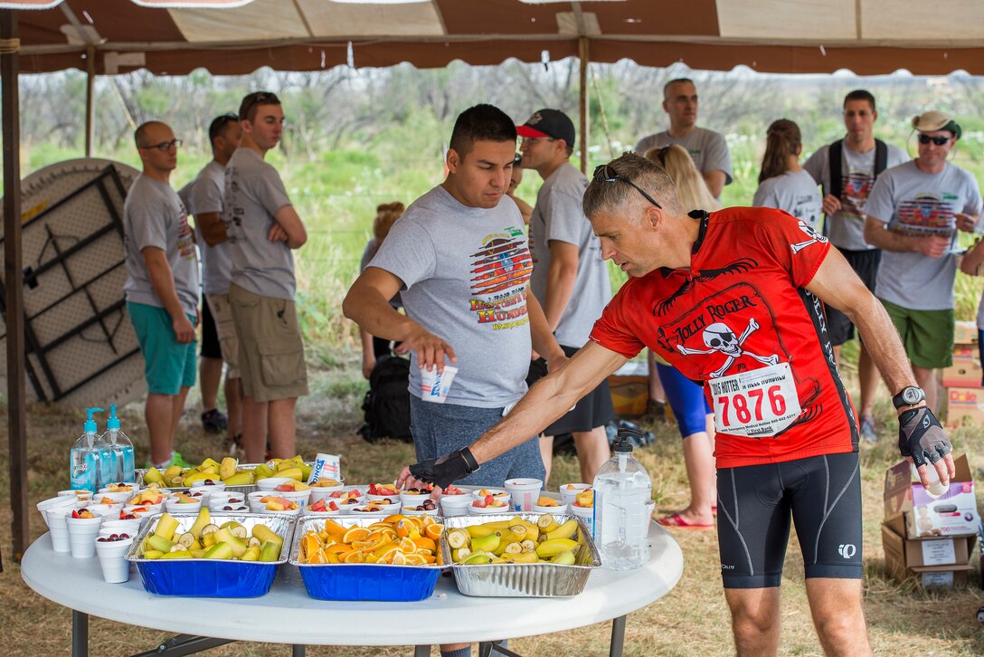 David Otto stops at checkpoint two along the Hotter’N Hell bike route through Wichita Falls, Texas, Aug. 29, 2015. Otto, along with more than 12,000 other cyclists, participated in the 34th annual Hotter’N Hell 100 bike race, which includes distances of 10 and 100 kilometers, and 25, 50 and 100 miles. (U.S. Air Force photo by Senior Airman Kyle Gese/Released)