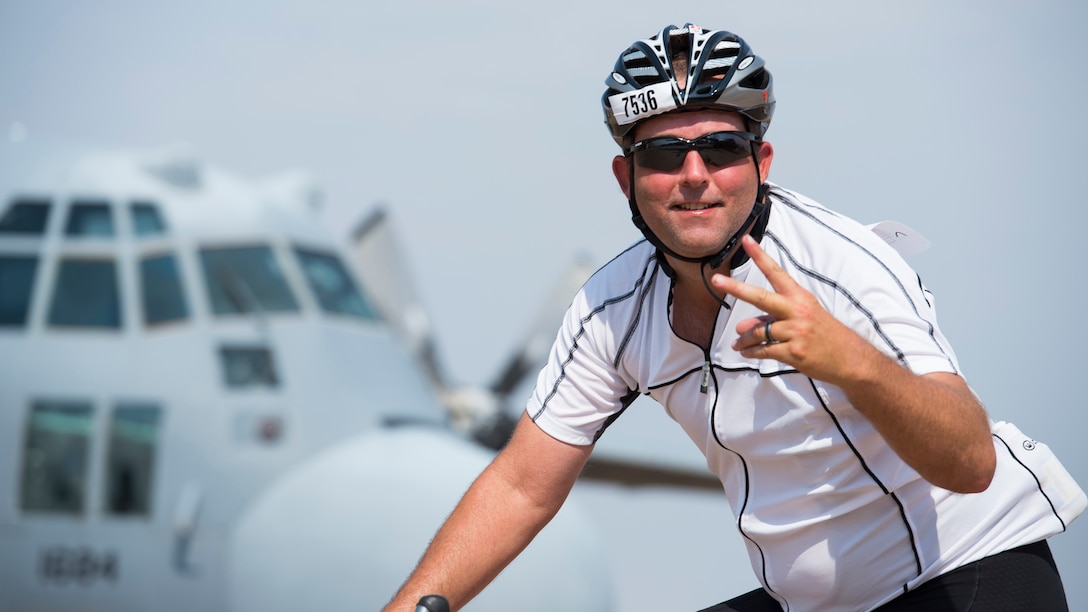 A cyclist passes through ‘Air Power Alley’ on Sheppard Air Force Base, Texas, during the Hotter’N Hell 100 bike race Aug. 29, 2015. More than 12,000 cyclists from all over the U.S and other countries around the world, come to participate in the Hotter’N Hell race each year. (U.S. Air Force photo by Senior Airman Kyle Gese/Released)