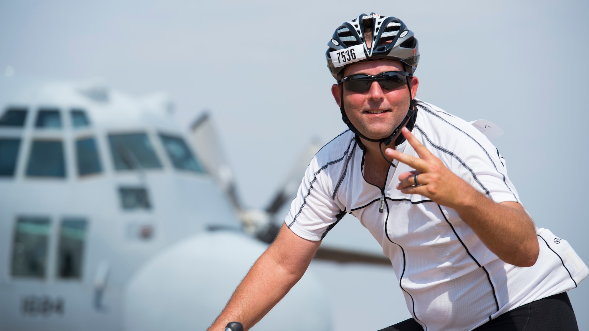A cyclist passes through ‘Air Power Alley’ on Sheppard Air Force Base, Texas, during the Hotter’N Hell 100 bike race Aug. 29, 2015. More than 12,000 cyclists from all over the U.S and other countries around the world, come to participate in the Hotter’N Hell race each year. (U.S. Air Force photo by Senior Airman Kyle Gese/Released)