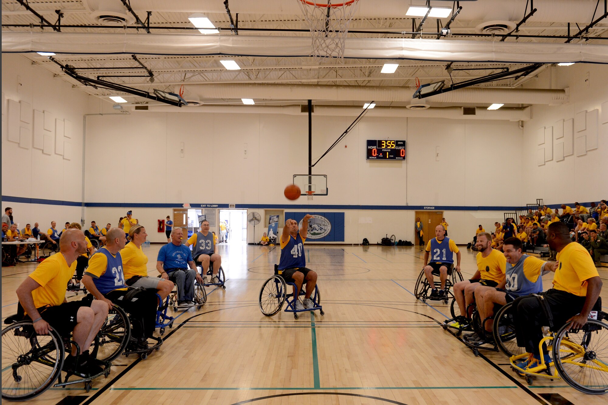Col. Leonard Kosinski, 62nd Airlift Wing commander, shoots a freethrow during a wheelchair basketball game Aug. 28, 2015, during the Wounded Warriors Adaptive Sports Camp at Joint Base Lewis-McChord, Wash. The event was the first time the Air Force and the Army has worked together on an introductory sports camp for Wounded Warriors. (U.S. Air Force photo/Airman 1st Class Keoni Chavarria)