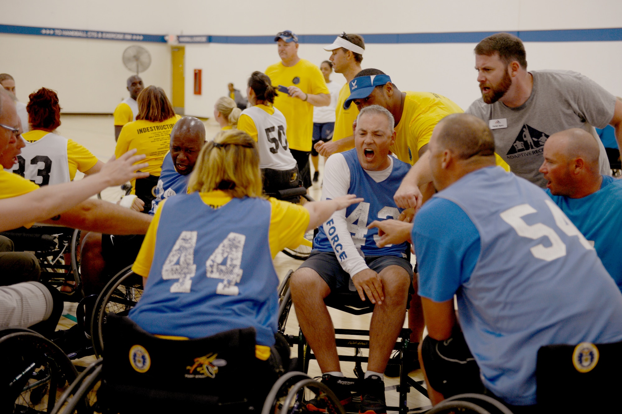 Adaptive Sports Camp participants cheer before competing in a wheelchair basketball game Aug. 28, 2015, during the Wounded Warriors Adaptive Sports Camp at Joint Base Lewis-McChord, Wash. More than 160 athletes and 40 staff members participated in the camp. (U.S. Air Force photo/Airman 1st Class Keoni Chavarria)