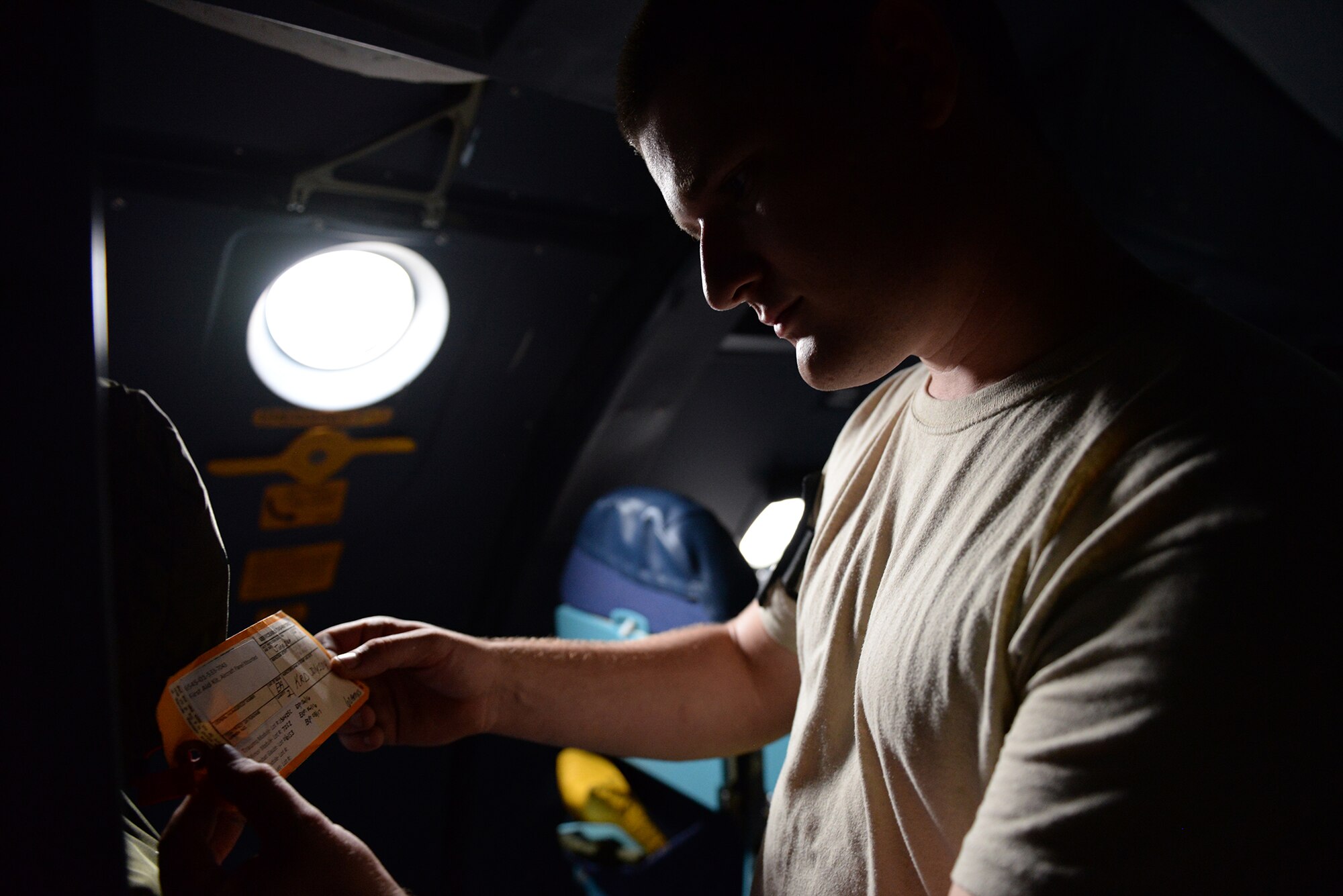 Senior Airman Joseph Galloway, 730th Air Mobility Squadron jet propulsion technician, inspects a tag on the upper deck of a C-5 Galaxy at Yokota Air Base, Japan, Aug. 31, 2015. Inspections ensure the aircraft support equipment and parts are in good working condition, keeping the aircrew and passengers safe during flights. (U.S. Air Force photo by Airman 1st Class Elizabeth Baker/Released)