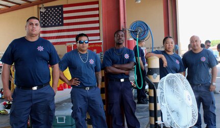 SOTO CANO AIR BASE, Honduras - Firefighters representing the Belize National Fire Service pose for a group picture during the Fire Ground Physical Challenge, Aug. 25, 2015, during CENTAM SMOKE, a quarterly exercise hosted by Joint Task Force-Bravo at Soto Cano Air Base, Honduras.  CENTAM SMOKE allows participants to share experiences and mutual knowledge in order to develop lasting relationships and to improve interoperability between nations.  (U.S. Army photo by Maria Pinel)
