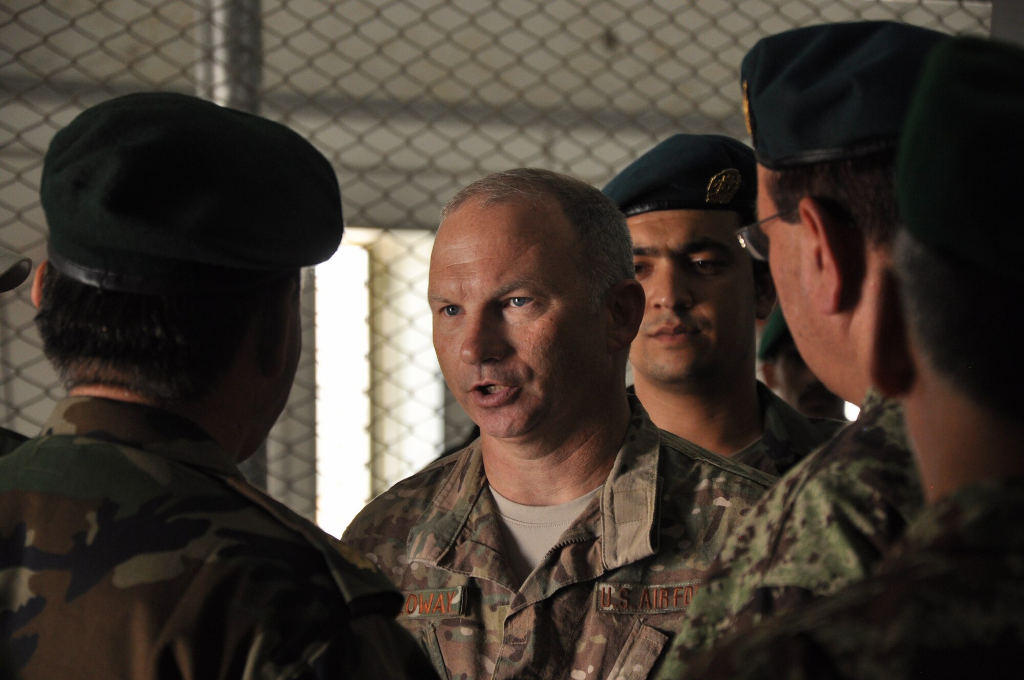 Helmand, Afghanistan (July 25, 2015) - U.S. Air Force Col. Donald Holloway, Resolute Support Advise and Assist Cell-Southwest team lead catches up with Maj. Gen. Eqbil Ali Afghan Ministry of Defense General Staff, G6, Communications  after a the general addressed ANA 215th Corps at Camp Shorab.