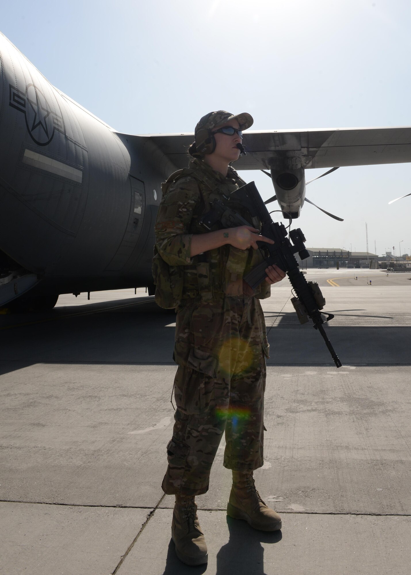 U.S. Air Force Staff Sgt. Brandee Hahn, 455th Expeditionary Security Forces Squadron non-commissioned officer in charge of the fly away security team, provides security for a C-130J Super Hercules aircraft and crew members during a mission Aug. 28, 2015, Hamid Karzai International Airport, Kabul, Afghanistan. Hahn is a FAST member and is responsible for protecting mission essential assets, the aircraft and crew members when flying to locations that have limited airfield security. (U.S. Air Force photo by Senior Airman Cierra Presentado/Released)