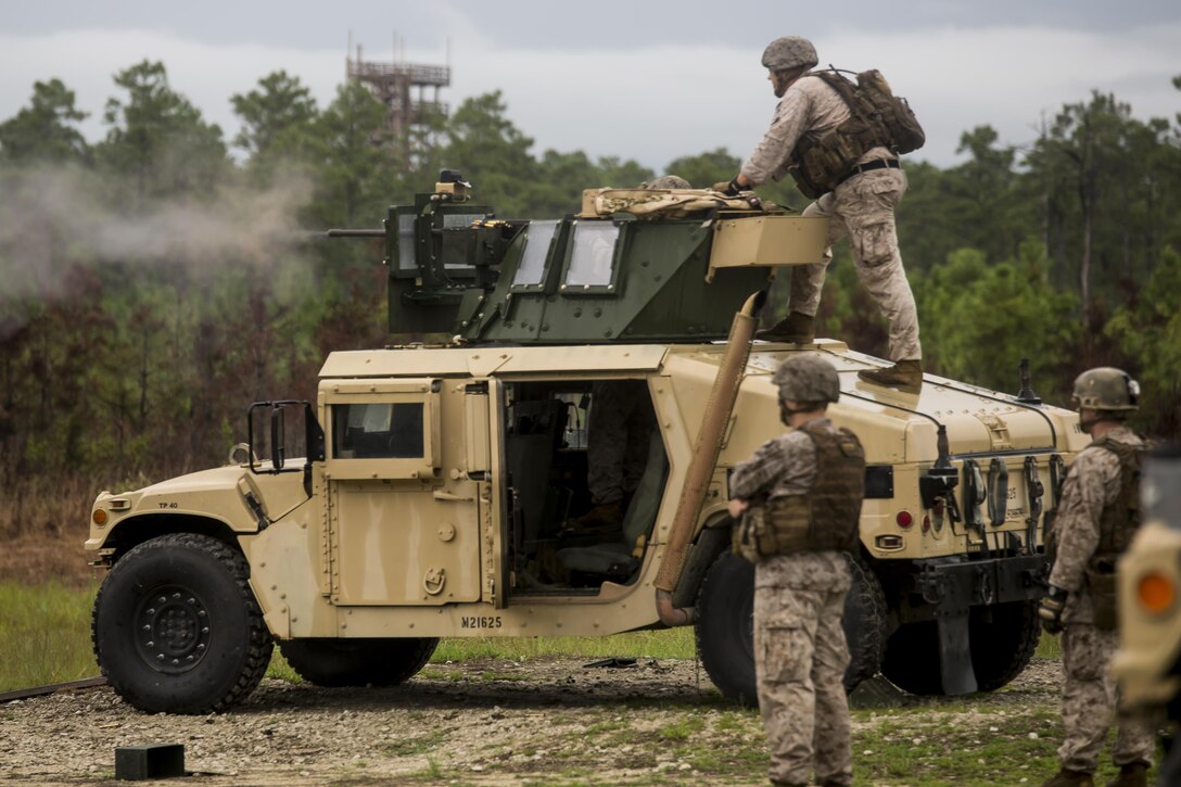 A Marine with 2nd Air Naval Gunfire Liaison Company, II Marine Expeditionary Force shoots an M2 .50 Caliber Heavy Machine Gun from the top of a HUMVEE during a week-long field exercise at Camp Lejeune, N.C., Aug. 27, 2015. The Marines were conducting this training in order to uphold their readiness and standards in support of II Marine Expeditionary Force and to re-familiarize themselves with the weapons system. (U.S. Marine Corps photo by Cpl. Krista James/Released)